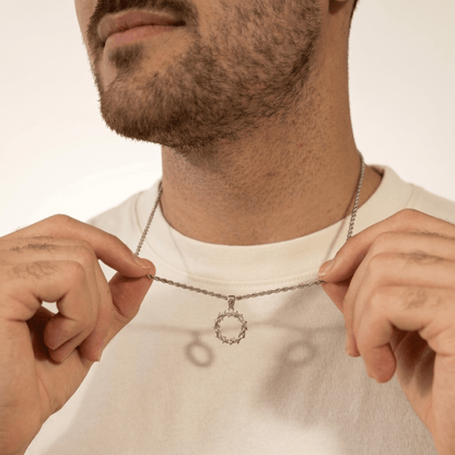 Man wearing silver Crown of Thorns Necklace with white shirt