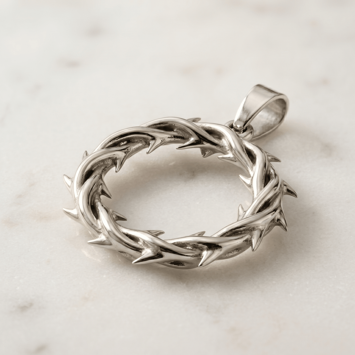 Close-up of silver Crown of Thorns pendant detail