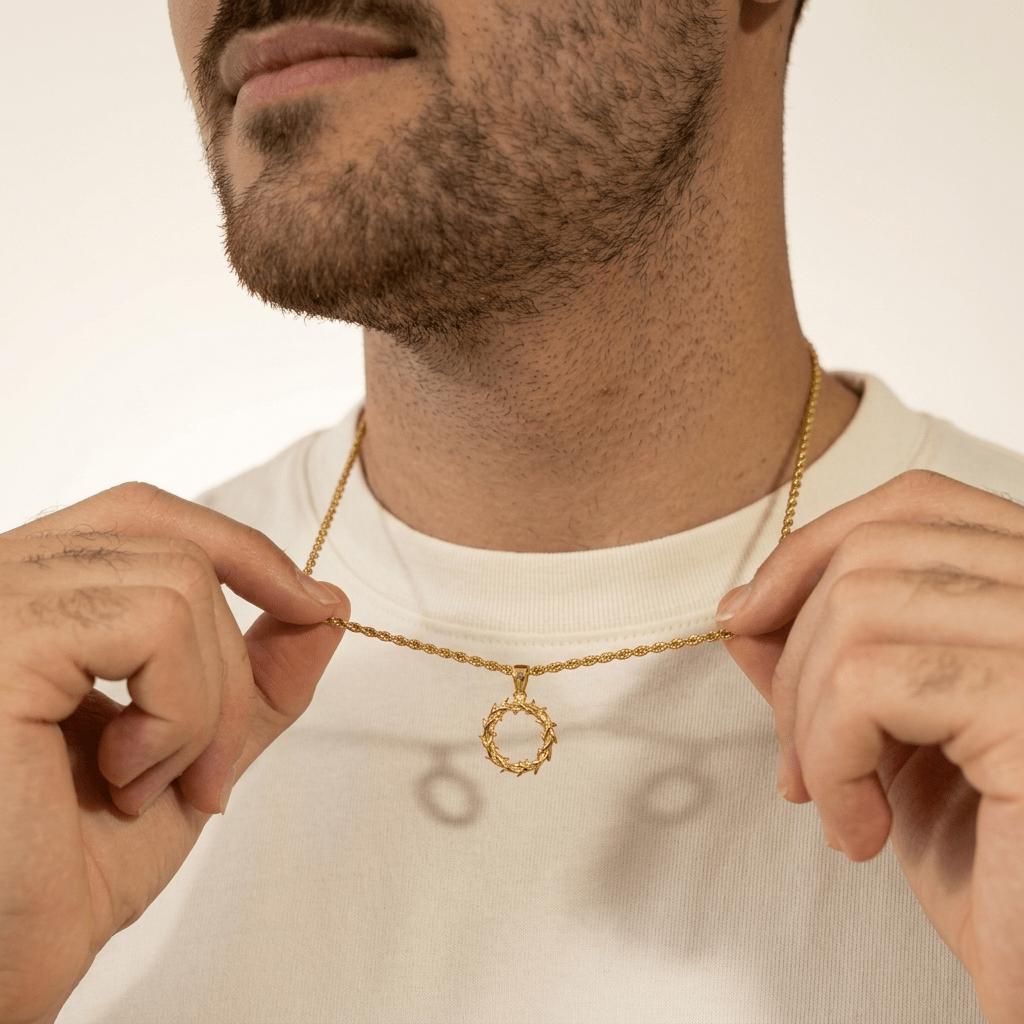 Man wearing gold Crown of Thorns Necklace with white shirt